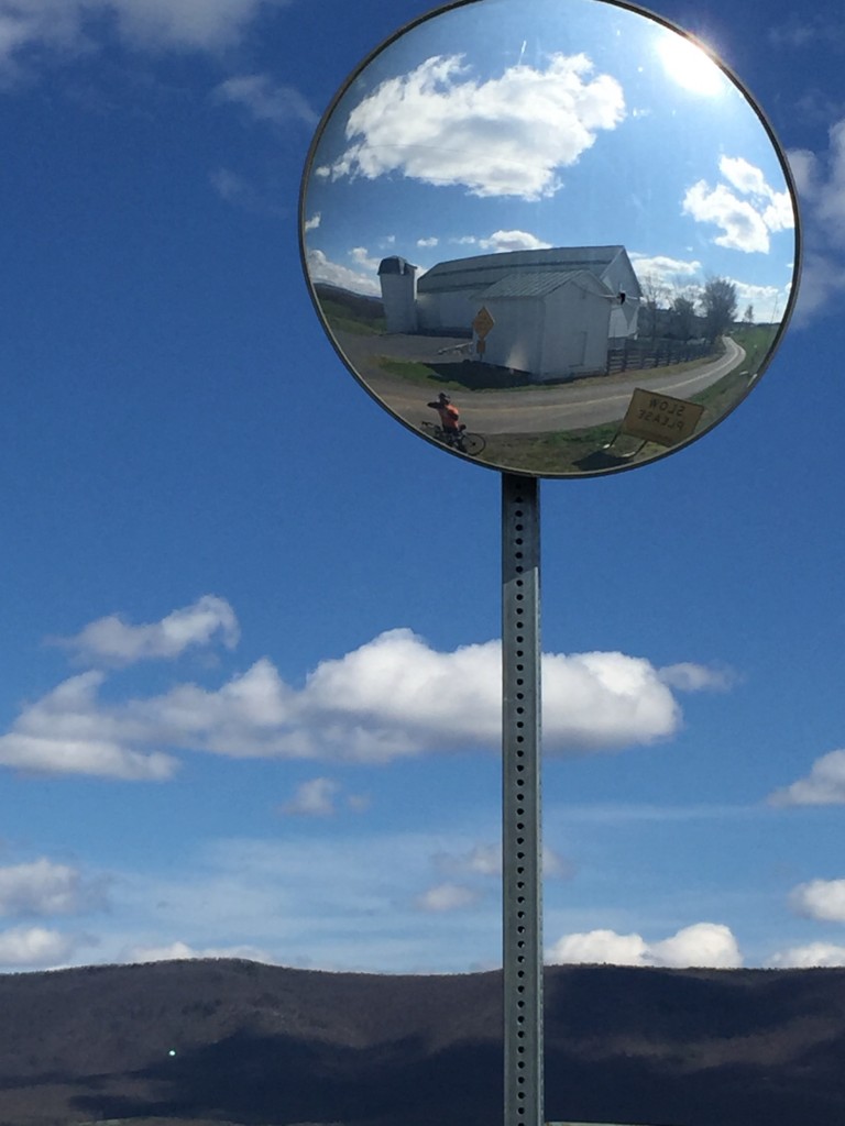 cyclists in mirror at intersection in shenandoah valley